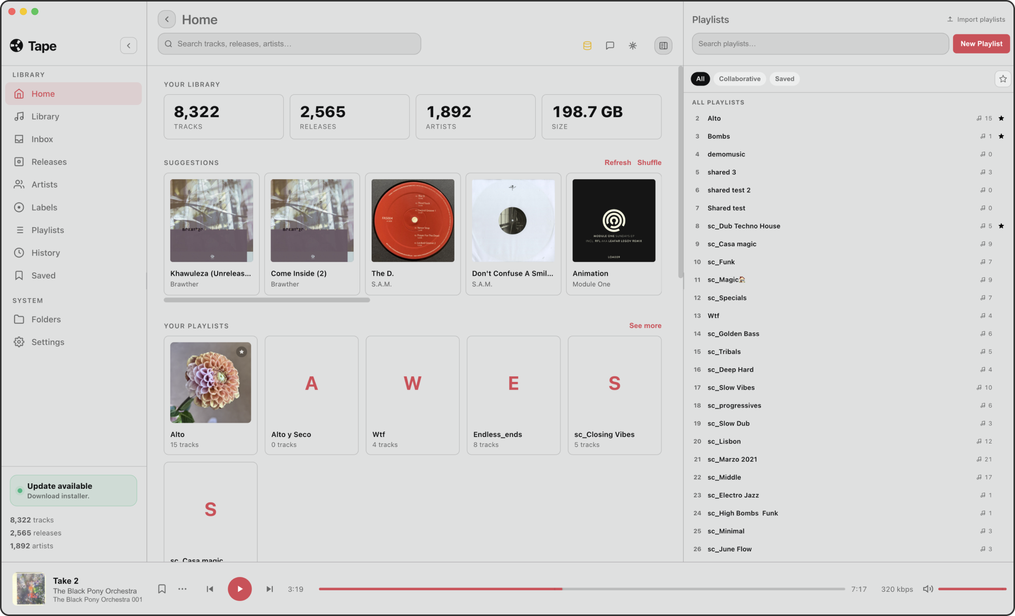 The Tape desktop hub home screen, showing a real library of 8,322 tracks, 2,565 releases and 1,892 artists, alongside the playlists panel